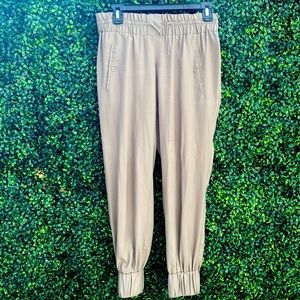 Neutral, sage green joggers. Light weight with cute details.